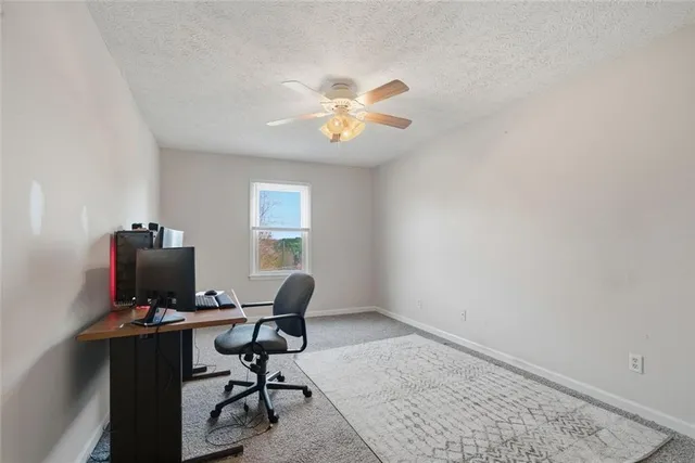 a bed sitting in a room next to a window