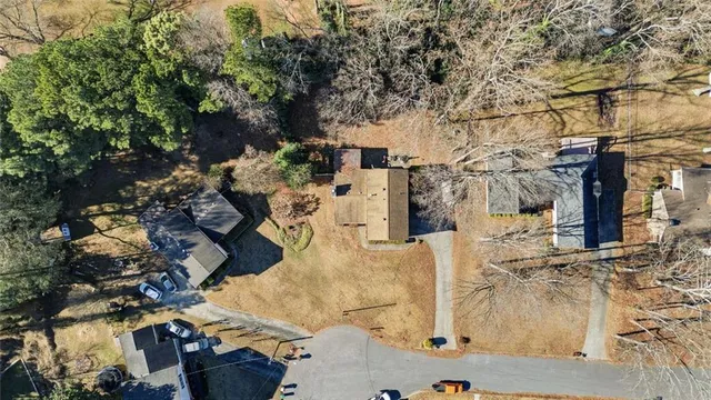 an aerial view of a residential apartment building with a yard
