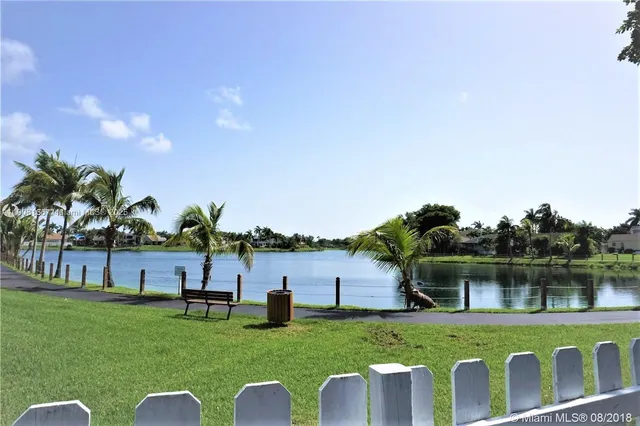 a front view of a house with garden and patio