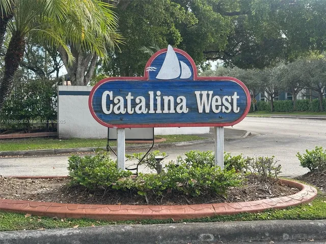 a view of sign board and a yard