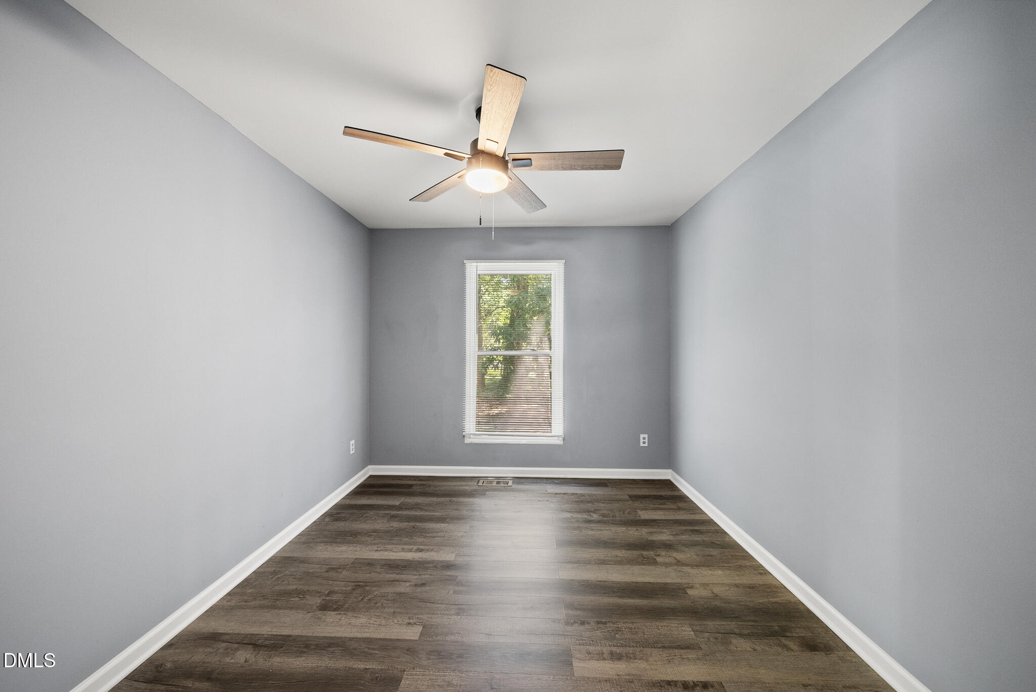 2108 Treverton Place Raleigh, NC 27609 - Photo 12 of 30 wooden floor in an empty room with a window