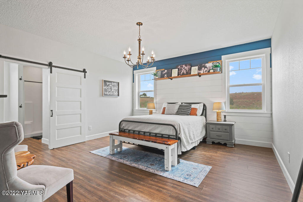 1058 East Road Bickleton, WA 99322 - Photo 32 of 39 a bedroom with a bed and a window