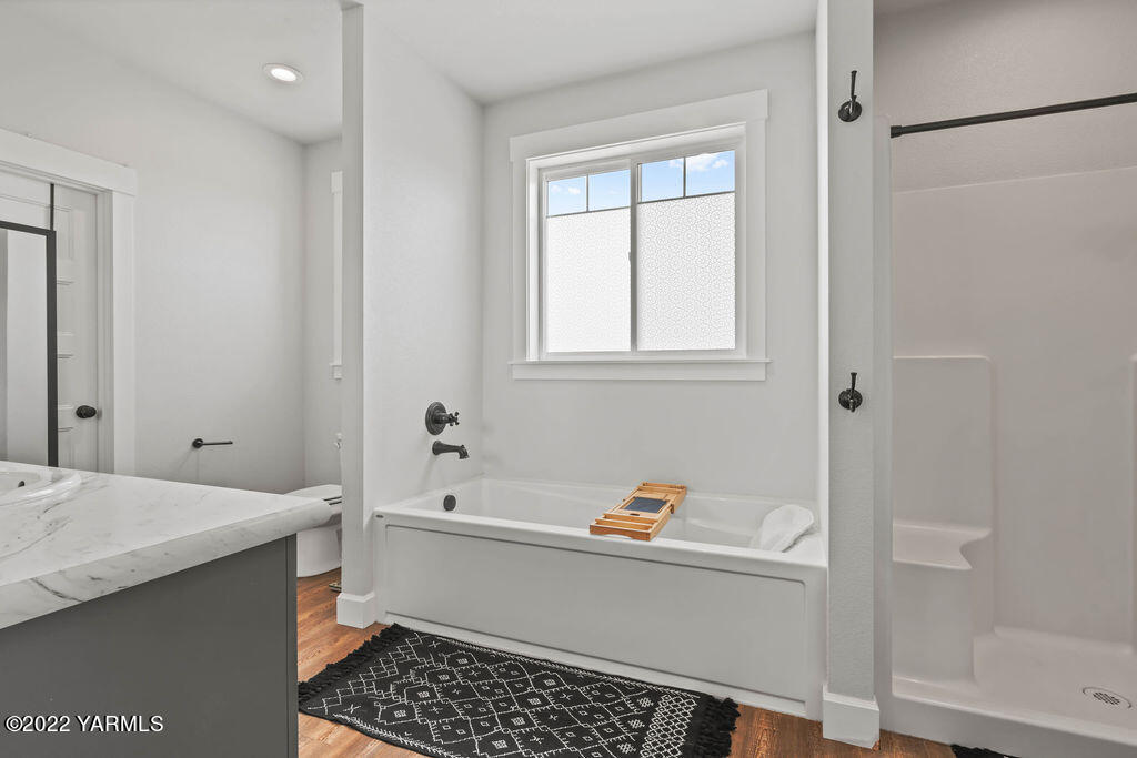 1058 East Road Bickleton, WA 99322 - Photo 36 of 39 a bathroom with a bathtub and a shower