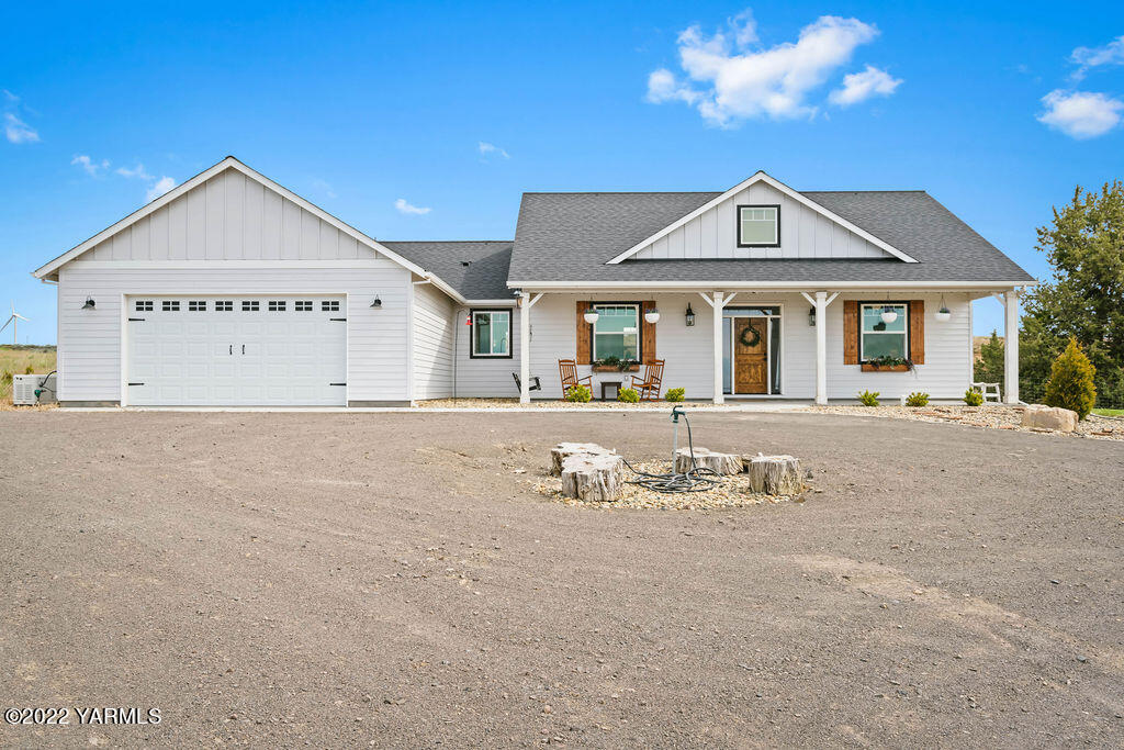 1058 East Road Bickleton, WA 99322 - Photo 5 of 39 a view of a white house with a large tree