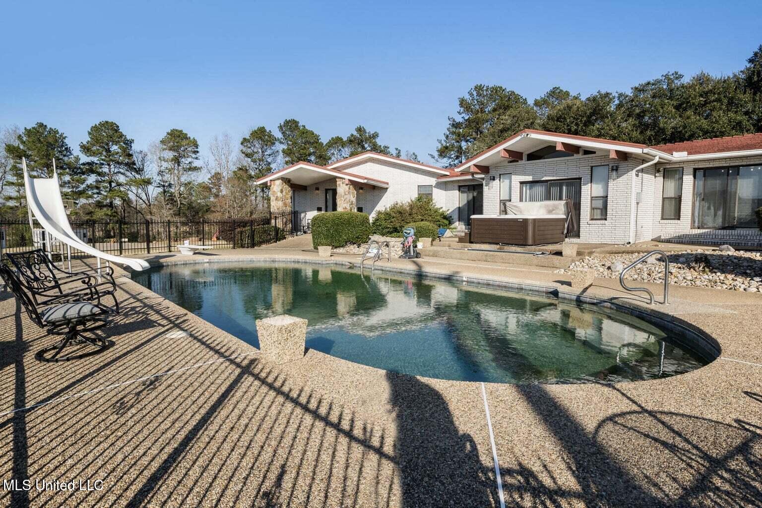 113 Lucas Road Sumrall, MS 39482 - Photo 41 of 52 Pool Area with Hot Tub
