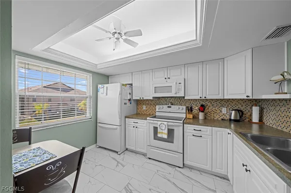 a kitchen with a stove a sink and dishwasher