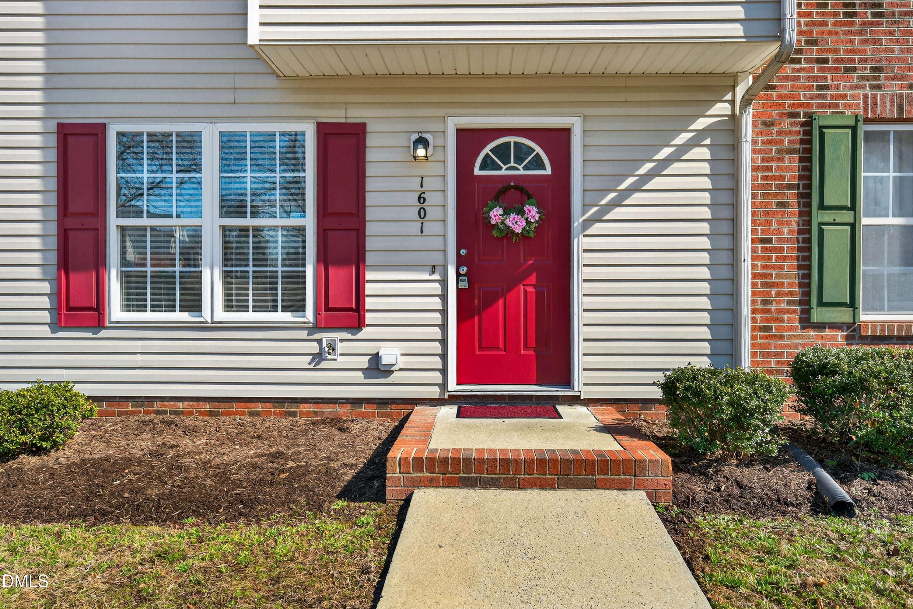 1601 Briarmont Court Raleigh, NC 27610 - Photo 3 of 30 a front view of a house with a yard