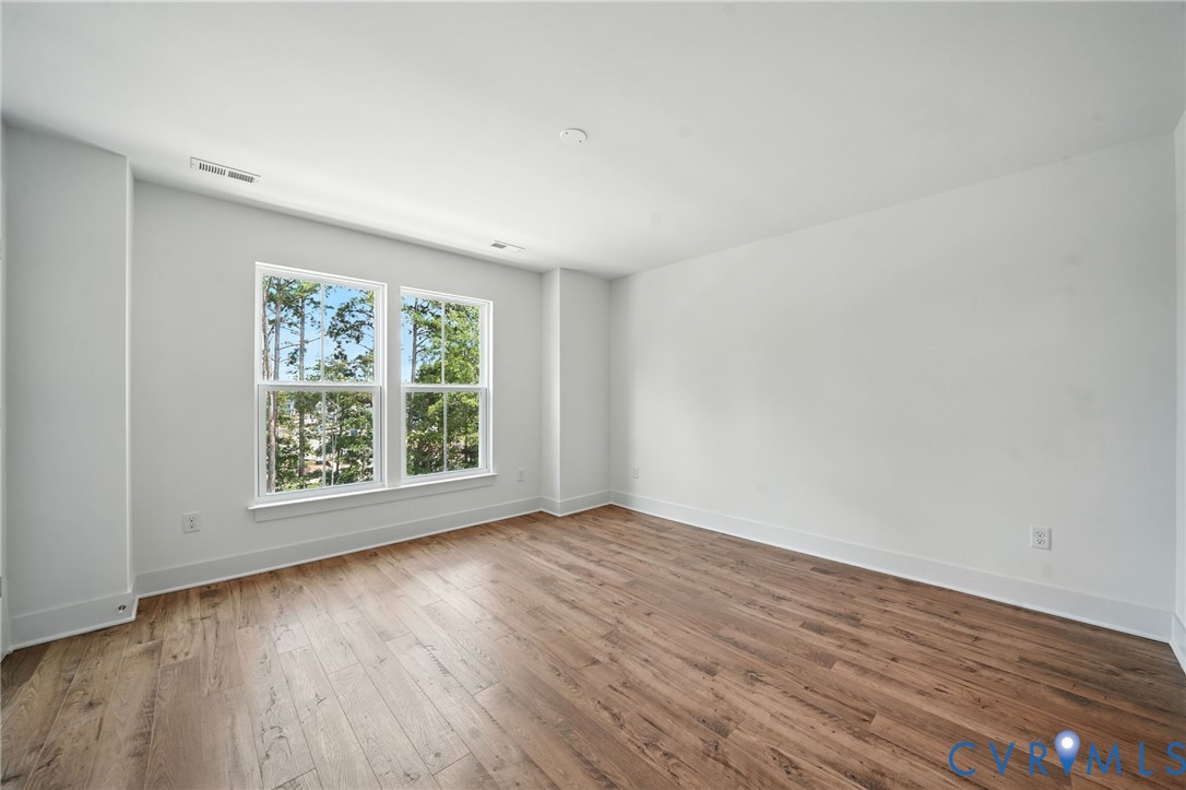 15307 Sunray Way Chesterfield, VA 23832 - Photo 11 of 27 a view of an empty room with wooden floor and a window