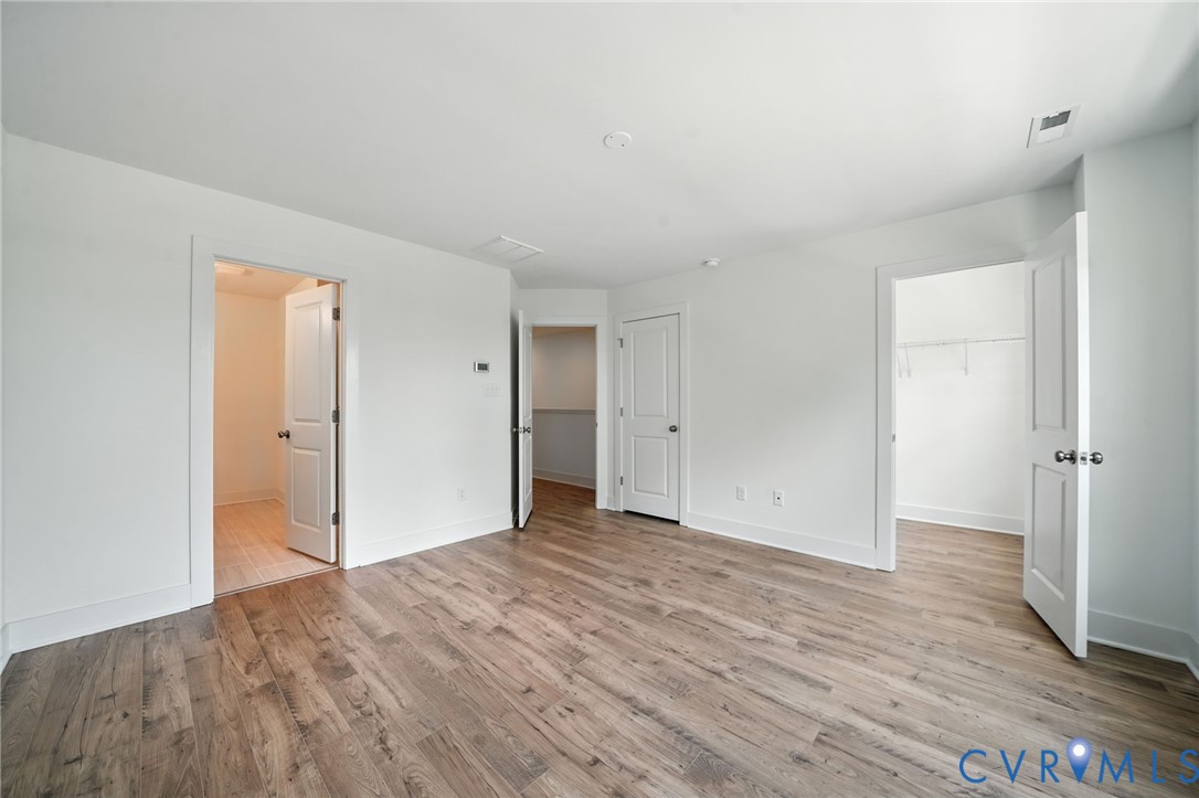 15307 Sunray Way Chesterfield, VA 23832 - Photo 12 of 27 a view of an empty room with wooden floor and closet