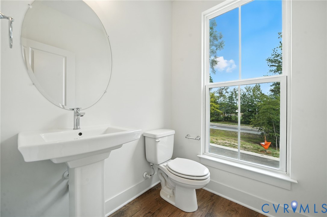 15307 Sunray Way Chesterfield, VA 23832 - Photo 19 of 27 a bathroom with a toilet a sink and a mirror