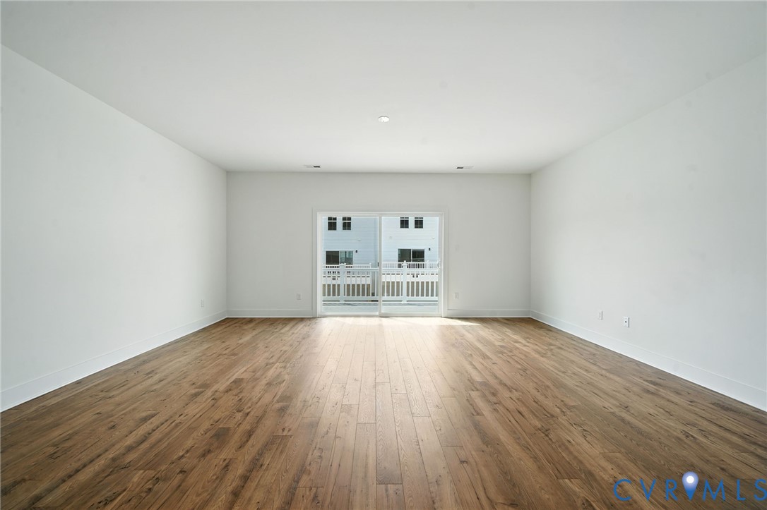 15307 Sunray Way Chesterfield, VA 23832 - Photo 3 of 27 an empty room with wooden floor and windows