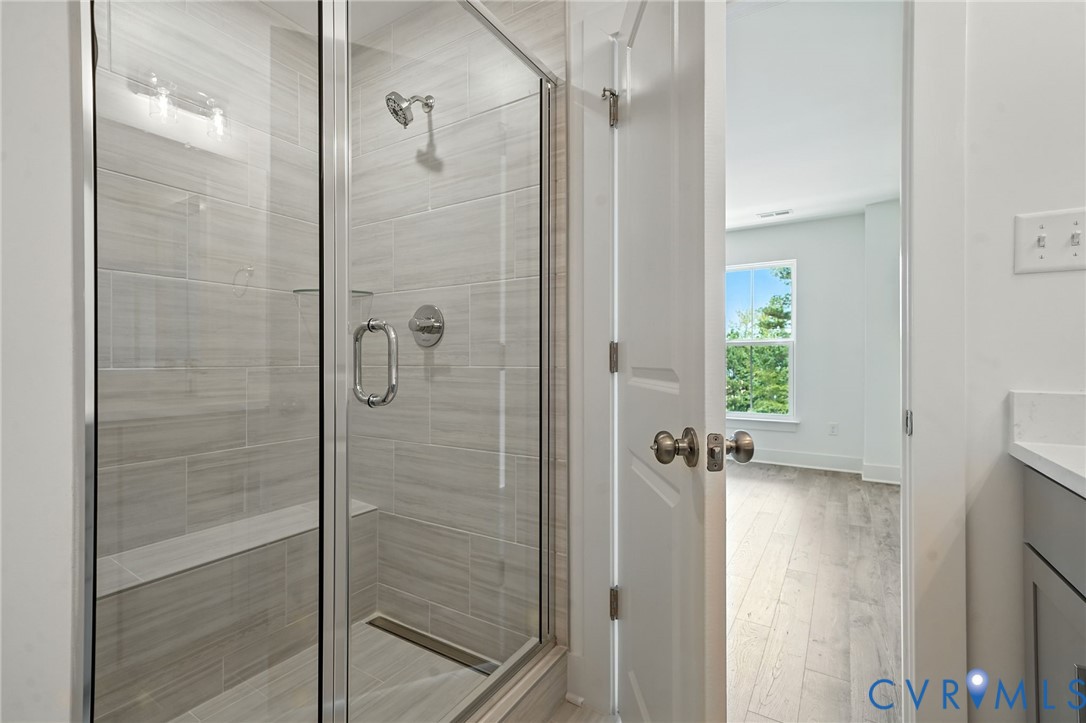 15307 Sunray Way Chesterfield, VA 23832 - Photo 4 of 27 a bathroom with a glass shower door