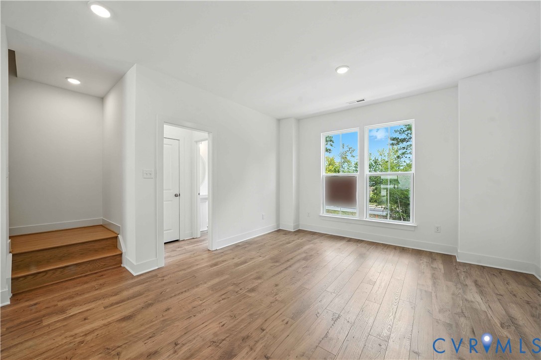 15307 Sunray Way Chesterfield, VA 23832 - Photo 8 of 27 an empty room with wooden floor and windows
