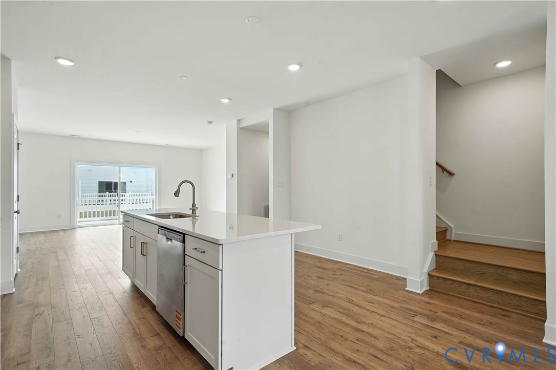 15307 Sunray Way Chesterfield, VA 23832 - Photo 10 of 27 a kitchen with white cabinets appliances and wooden floor