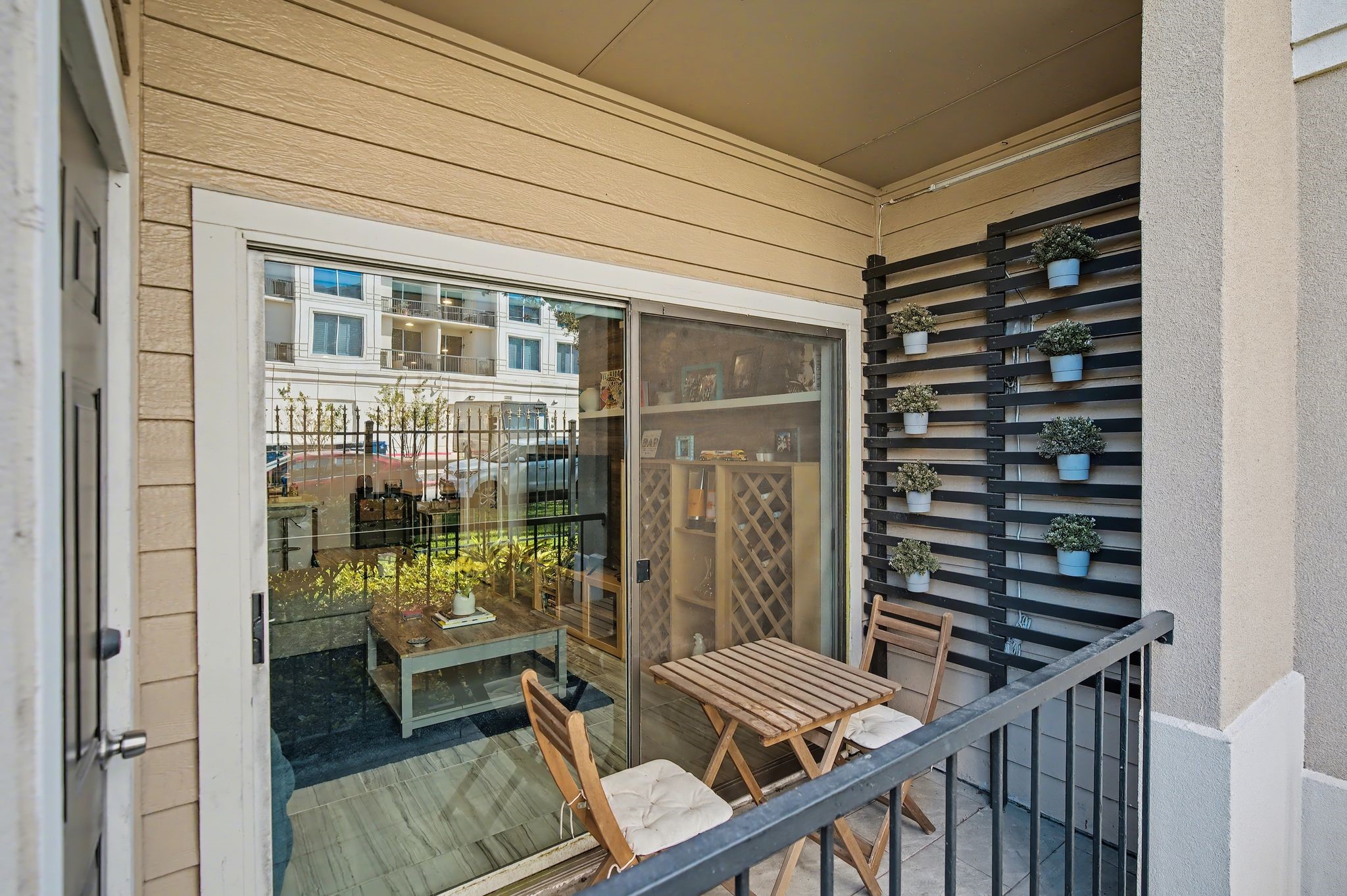 3231 Allen Parkway, Unit 2104 Houston, TX 77019 - Photo 9 of 14 a balcony with chairs and wooden floor