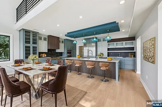 a kitchen with stainless steel appliances kitchen island granite countertop a sink and cabinets