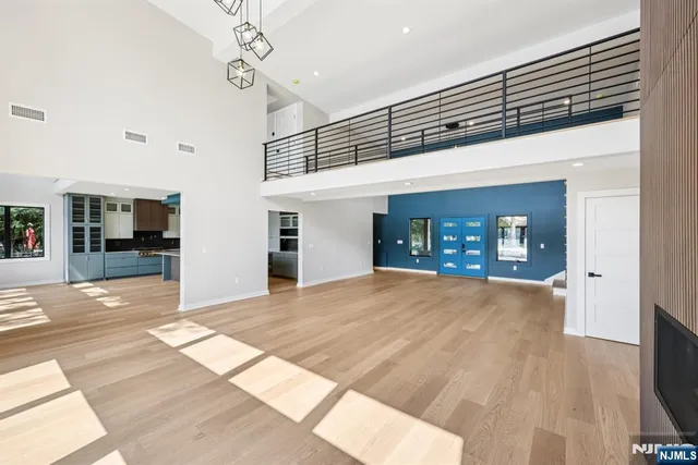 a view of livingroom with an empty space and a fireplace