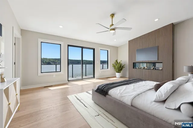 a bedroom with a large bed and a window