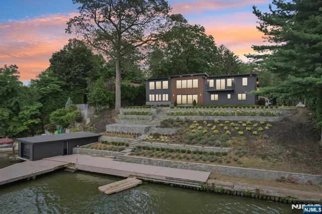 a view of a wooden house with a yard