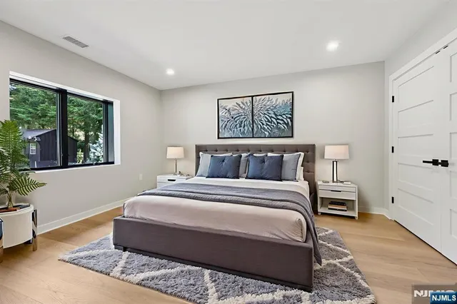 a bedroom with bed and window