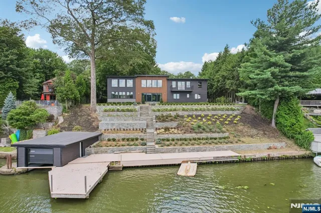 a view of a swimming pool with a patio and a garden