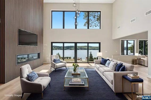 a living room with furniture fireplace and a flat screen tv