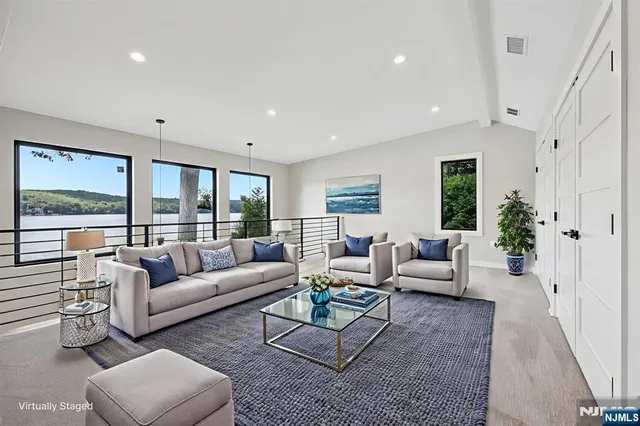 a living room with furniture or couch and a large window