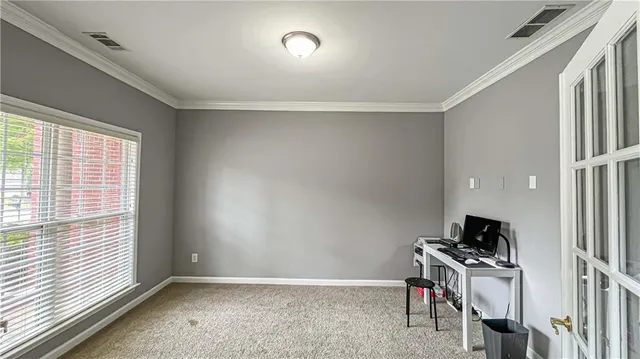 a living room with furniture kitchen view and a wooden floor