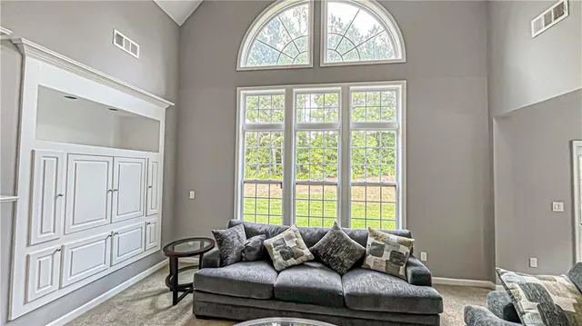 a outdoor dining space with furniture and wooden floor