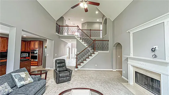 a spacious bathroom with a tub sink and mirror