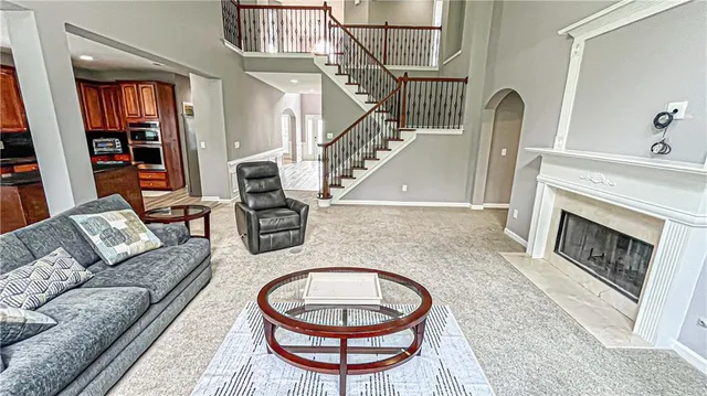 a view of a refrigerator a sink and dishwasher with wooden floor