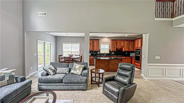 a view of walk in closet with clothes