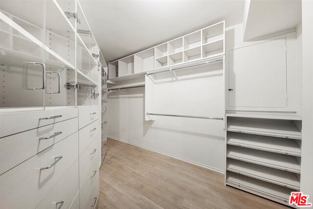 2345 Roscomare Road, Unit 201 Los Angeles, CA 90077 - Photo 11 of 18 a view of walk in closet with empty racks