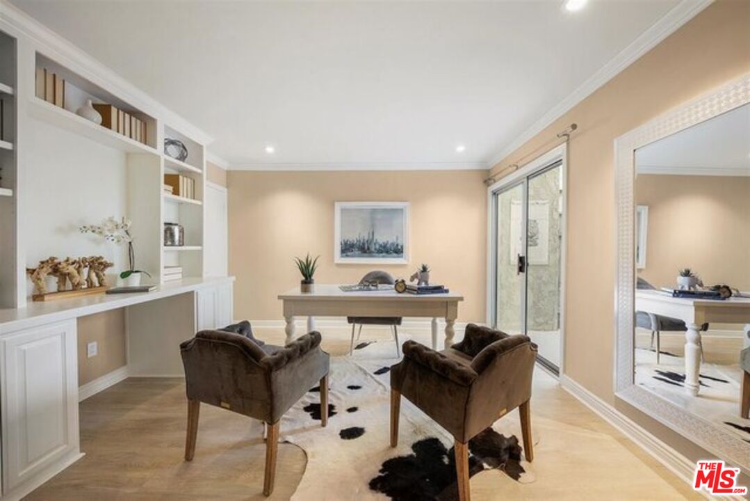 2345 Roscomare Road, Unit 201 Los Angeles, CA 90077 - Photo 12 of 18 a living room with furniture and a wooden floor
