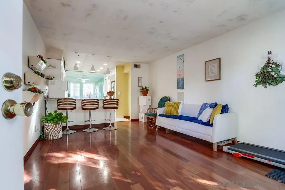 569 E Street, Unit 27 Chula Vista, CA 91910 - Photo 2 of 20 a living room with furniture and a chandelier