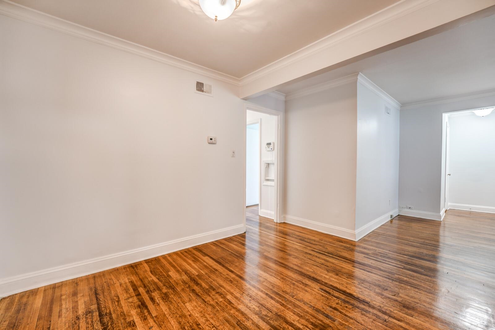 4613 Boyce Road Memphis, TN 38117 - Photo 12 of 35 a view of an empty room with wooden floor