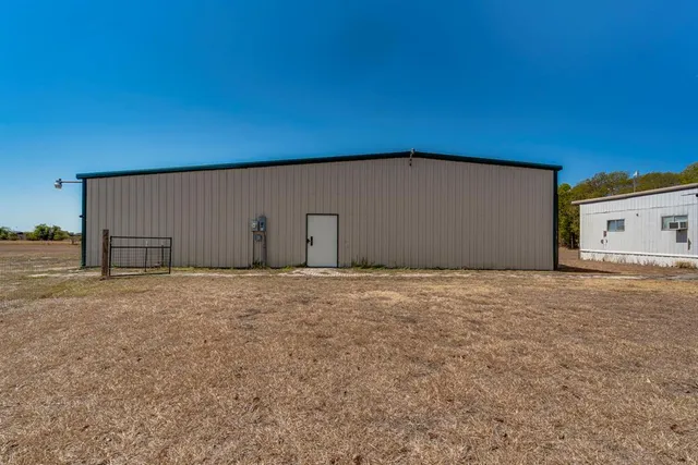 a backyard of house with garage