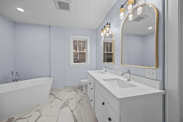 a bathroom with a bathtub and shower