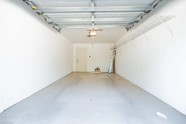 a view of a big room with chandelier fan