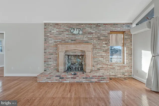 a view of fireplace with wooden floor
