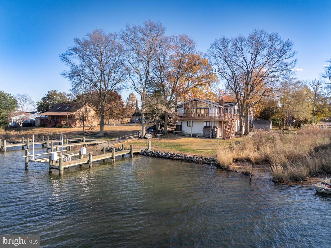 962 Main Street Deale, MD 20751 - Photo 2 of 54 a view of swimming pool with outdoor seating and plants