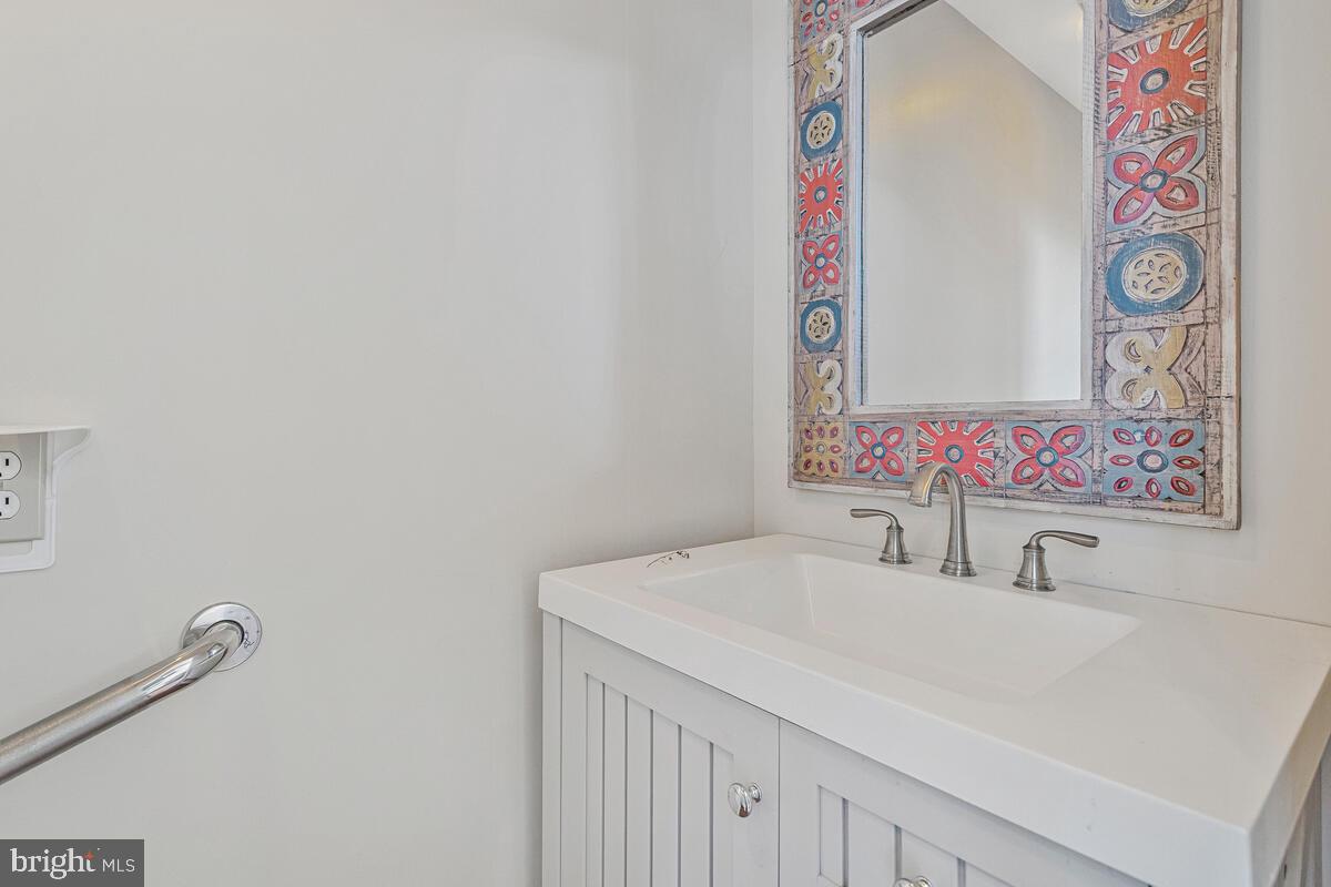 962 Main Street Deale, MD 20751 - Photo 21 of 54 a bathroom with a sink vanity and a mirror