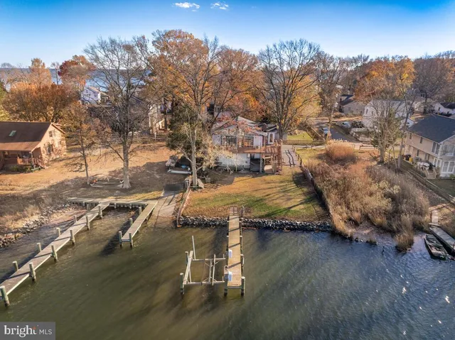 an aerial view of a house with a lake view
