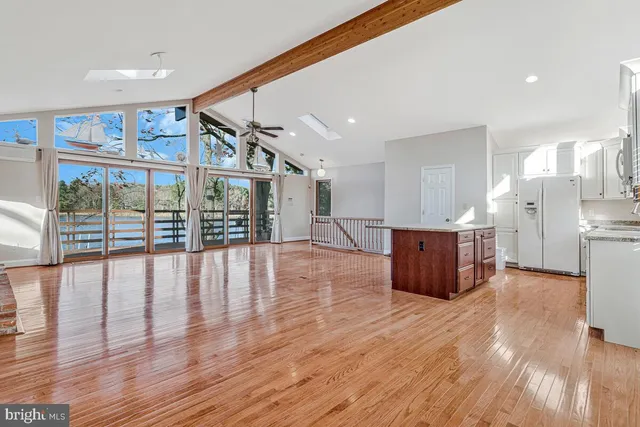 a view of kitchen with furniture and wooden floor