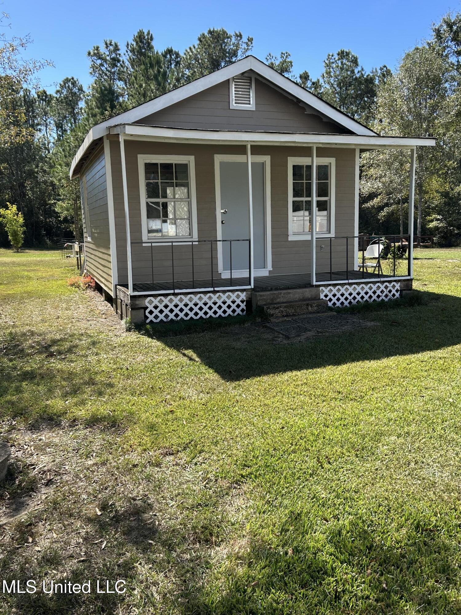 22473 Yankee Town Road Saucier, MS 39574 - Photo 57 of 67 Cottage Storage Building