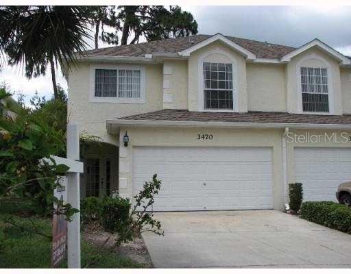 3470 Primrose Way Palm Harbor, FL 34683 - Photo 1 of 1 a front view of a house with a garage