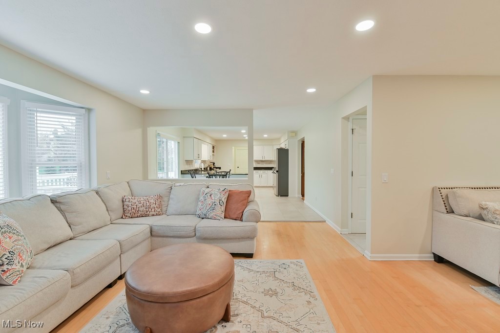 482 Longspur Road Highland Heights, OH 44143 - Photo 9 of 47 Living room featuring light wood-style floors, baseboards, and recessed lighting