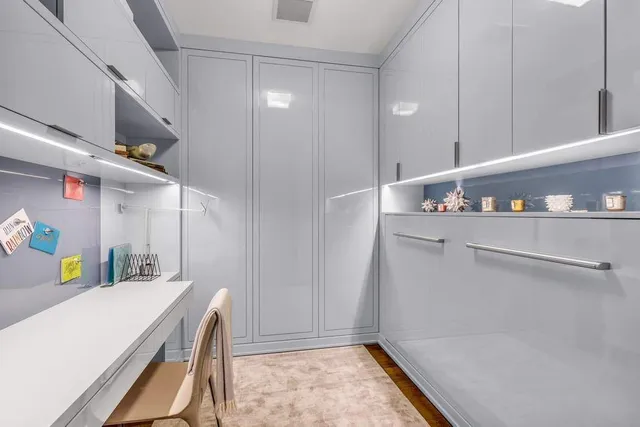 a kitchen with stainless steel appliances granite countertop a stove and a refrigerator