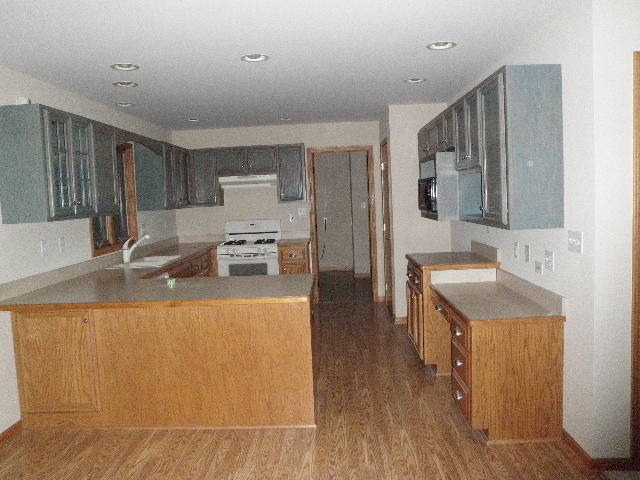 4780 East Grinter Road Gardner, IL 60424 - Photo 2 of 12 a kitchen with stainless steel appliances granite countertop a sink stove and refrigerator