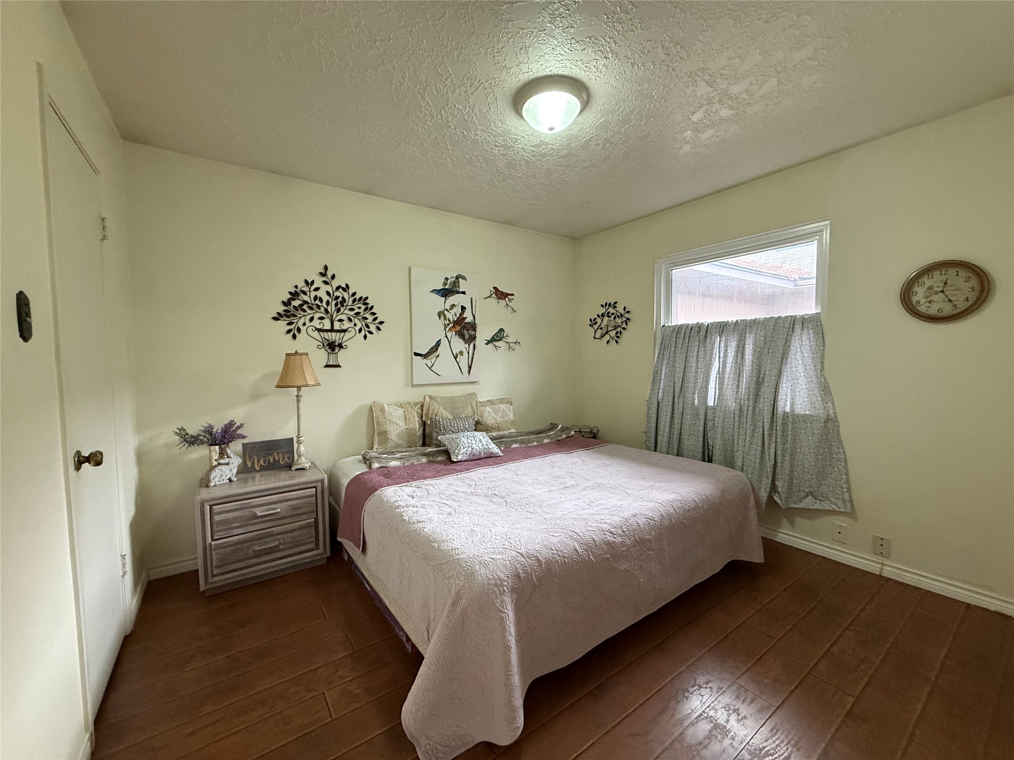4831 Diehlwood Place Spring, TX 77388 - Photo 11 of 12 a bedroom with a bed and a painting on the wall